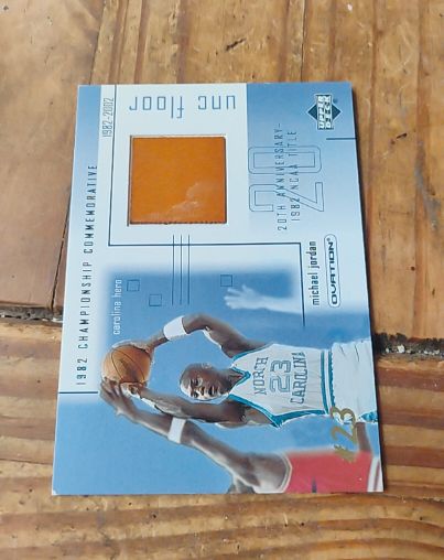 2001-02 Upper Deck Ovation #MJF4 Michael Jordan UNC Memorabilia Floor — front