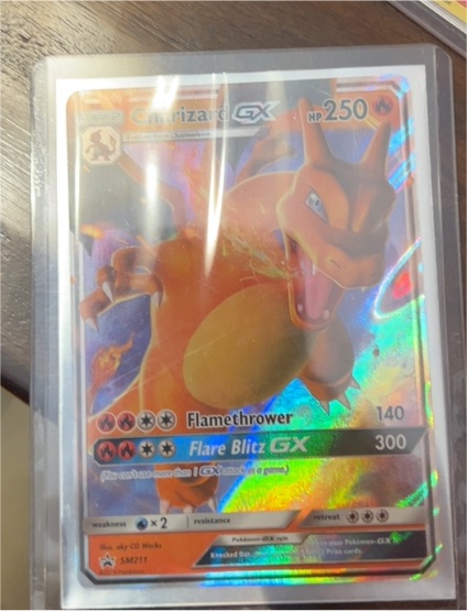 2019 Pokemon SM Black Star Promo Hidden Fates #SM211 Charizard GX — front
