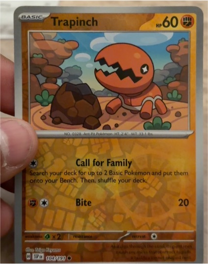 2022 Pokémon SV08: Surging Sparks #104 Trapinch — front