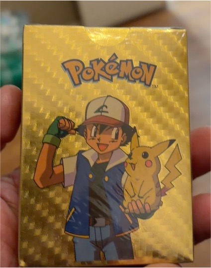 Pokémon Gold Foil Card Deck with Ash and Pikachu — front