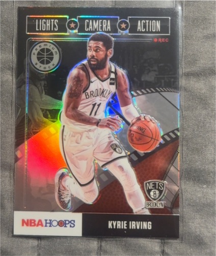 2019-20 Panini NBA Hoops Premium Stock #23 Kyrie Irving Lights Camera Action — front