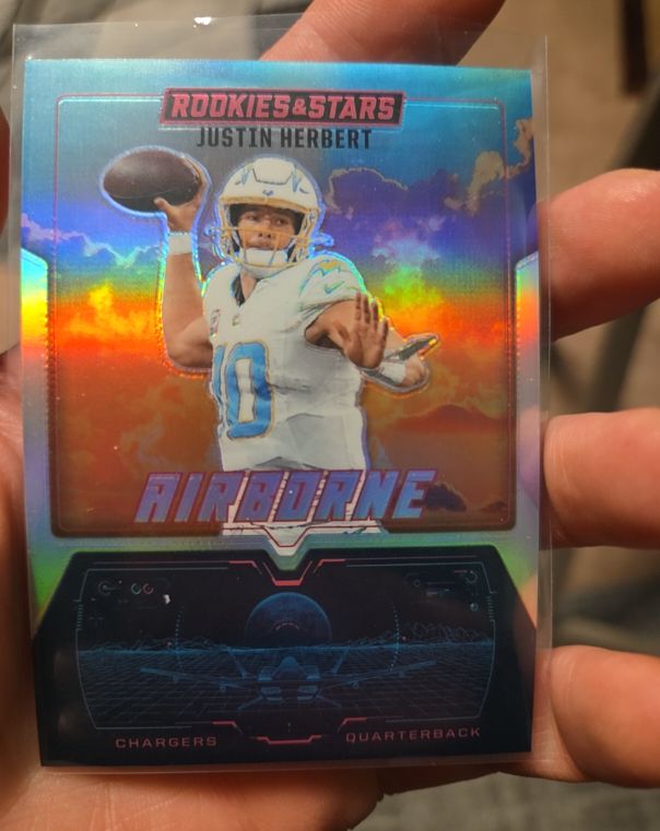 2025 Panini Rookies & Stars #18 Justin Herbert Airborne — front