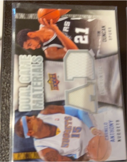 2009 Upper Deck Dual Game Materials #DG-NK Carmelo Anthony/Michael Jordan — front
