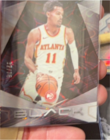 2023-24 Panini Black #9 Trae Young — front