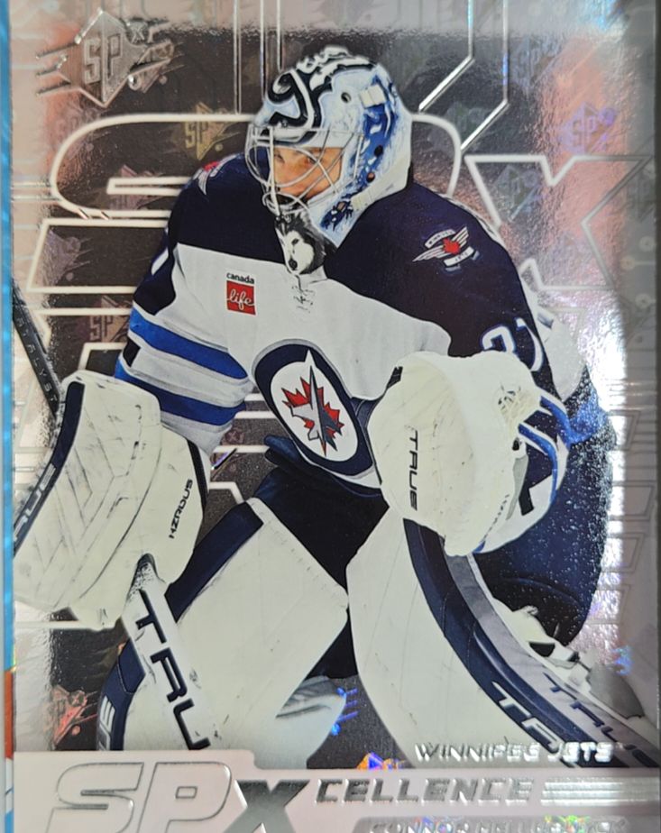 2024-25 UD SPx #XC-CH Connor Hellebuyck — front