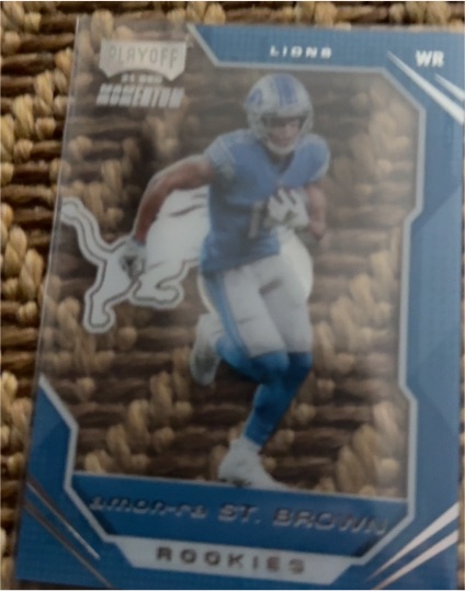 2021 Panini Chronicles #PMR-28 Amon-Ra St. Brown Playoff Momentum Rookies — front