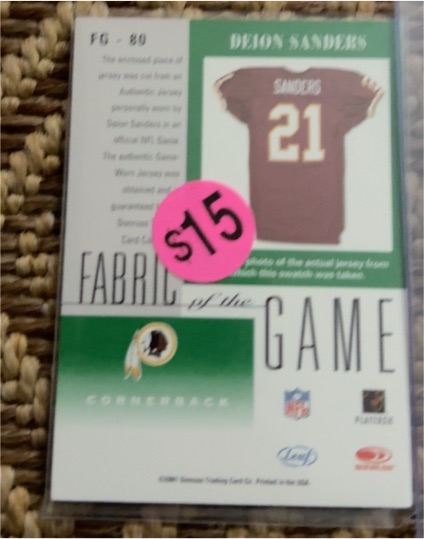 1997 Leaf Certified Fabric of the Game #FG-80 Deion Sanders — front