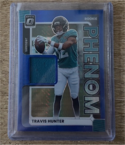 2025 Panini Donruss Optic #RPJ-TH Travis Hunter Rookie Phenom Patch — front