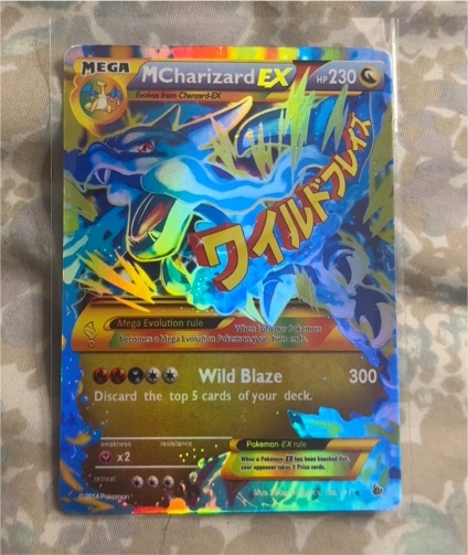 2014 Pokémon Flashfire #108/106 Mega Charizard EX — front