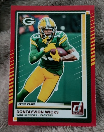 2025 Donruss #295 Dontayvion Wicks Press Proof Red — front