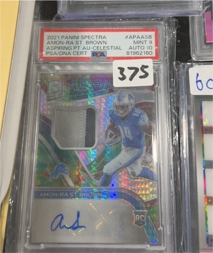 2021 Panini Spectra #APAASB Amon-Ra St. Brown — front