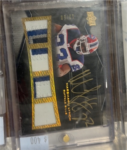 2009 Upper Deck Black #25/50 Marshawn Lynch Quad Game Used Patch Gold Ink Auto — front