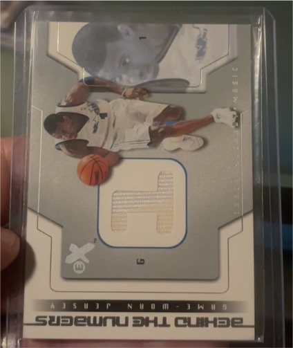2003-04 Fleer E-X Behind the Numbers Game-Used #X-BTNGU Tracy McGrady — front