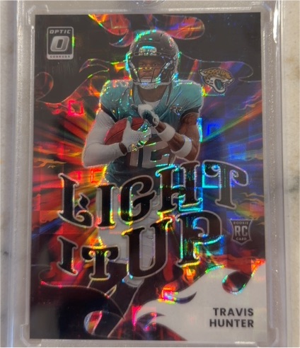 2025 Donruss Optic #4 Travis Hunter Light It Up Rookie Card — front