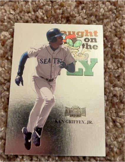1999 Skybox Metal Universe #233 Ken Griffey Jr. Caught on the Fly — front