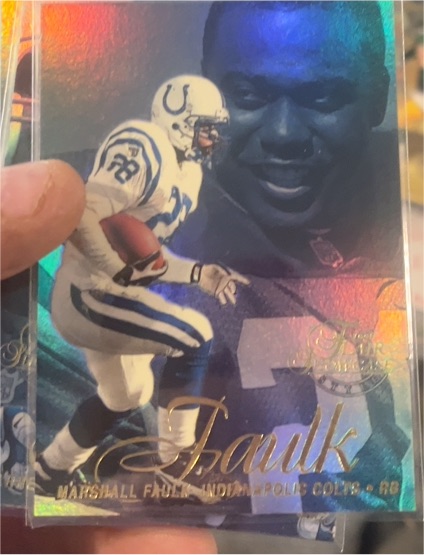 1997 Fleer Flair #28 Marshall Faulk — front