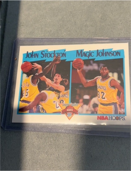 1991 NBA Hoops #312 Magic Johnson/John Stockton League Leaders Assists — front