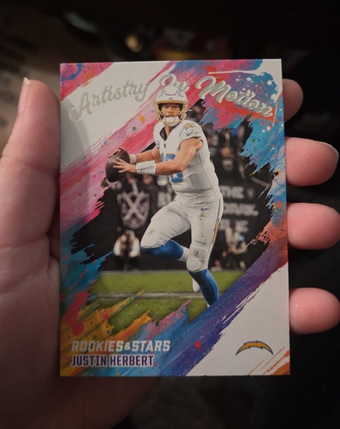 2025 Panini Rookies & Stars #11 Justin Herbert Artistry in Motion — front