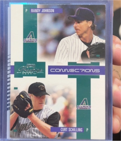 2004 Playoff Prestige #C-4 Randy Johnson / Curt Schilling Connections — front