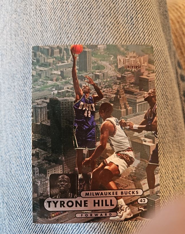 1997-98 Skybox Metal Universe #32 Tyrone Hill — front