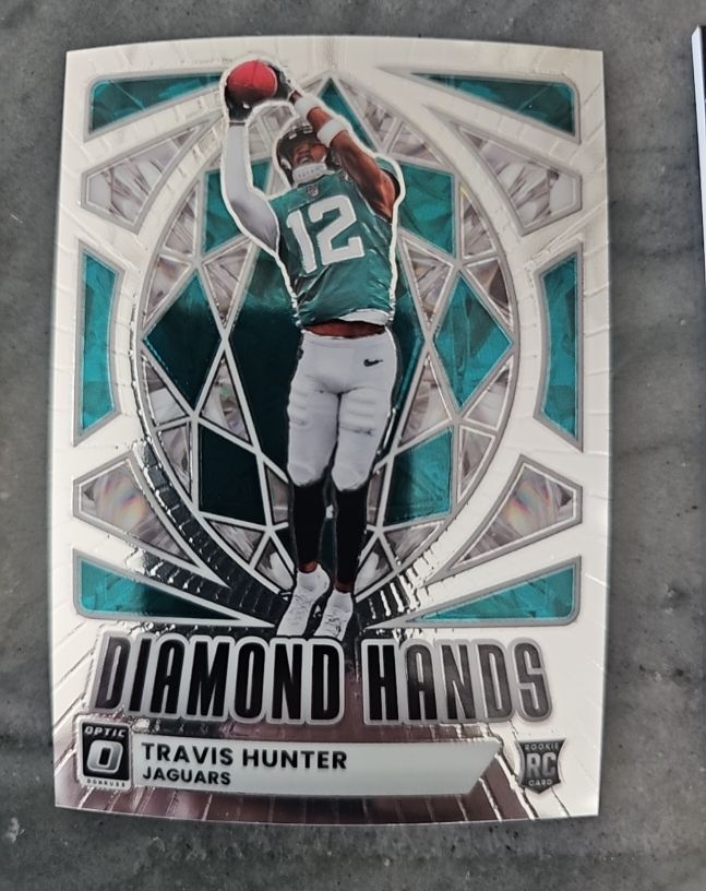 2025 Donruss Optic #1 Travis Hunter Diamond Hands Rookie — front