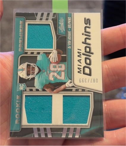 2023 Panini Absolute Rookie Premiere Materials #RPM-DA De'Von Achane — front