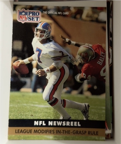 1991 Pro Set #345 League Modifies In-the-Grasp Rule John Elway — front