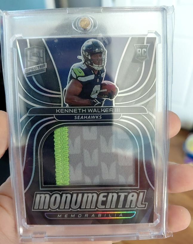 2022 Panini Spectra #MME-KWA Kenneth Walker III Monumental Memorabilia #/99 — front