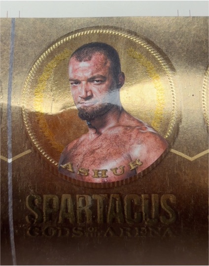 2012 Rittenhouse Spartacus Gods of the Arena Die-Cut Gold Plaque #GG4 Ashur — front