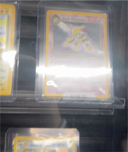 1999 Pokémon Team Rocket #18 Dark Alakazam — front
