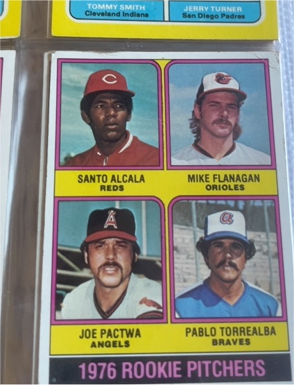 1976 Topps #589 Rookie Pitchers Mike Flanagan, Pablo Torrealba, Santo Alcala, Joe Pactwa — front