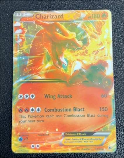 2014 Pokémon Charizard EX #12/106 — front