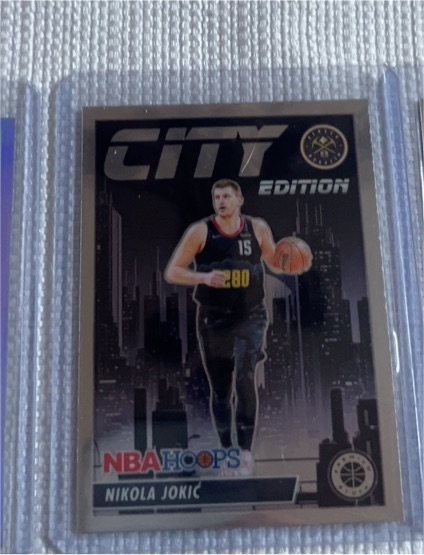 2023-24 Panini NBA Hoops Premium Stock #13 Nikola Jokić City Edition Silver Prizm — front