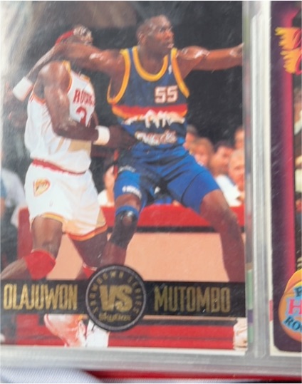 1993-94 Skybox Premium #SS4 Hakeem Olajuwon vs Dikembe Mutombo — front