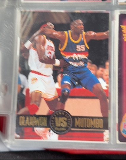 1993 Skybox Showdown Series #SS4 Hakeem Olajuwon vs Dikembe Mutombo — front