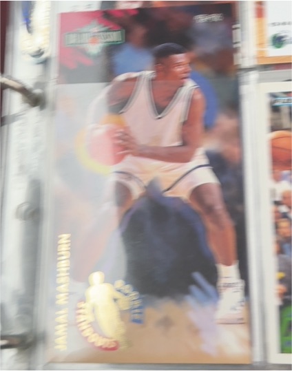 1995 SkyBox Basketball #28 Jamal Mashburn — front