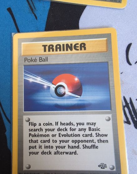 1999 Pokémon Jungle #64 Poke Ball Trainer — front