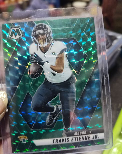2025 Panini Mosaic #121 Travis Etienne Jr. Green Mosaic Prizm — front