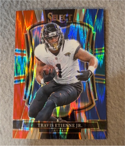 2025 Panini Select #130 Travis Etienne Jr. Premier Level Red and Blue Prizm Shock — front
