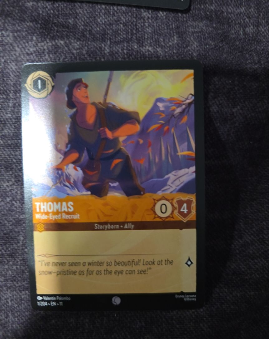 Disney Lorcana Winterspell #1/204 Thomas - Wide-Eyed Recruit — front