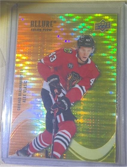 2022-23 Upper Deck Allure #SF-7 Alex Vlasic Color Flow Orange Yellow — front
