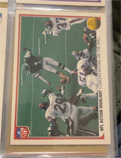 1983 Fleer NFL Team Action #84 NFL Action Highlight Concentrating on the Ball — front