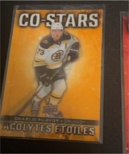 2023-24 Upper Deck Series 2 Dazzlers Orange #DZ-68 Charlie McAvoy — front