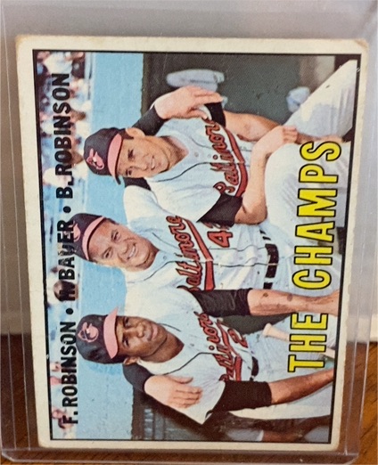 1967 Topps #1 The Champs Frank Robinson, Brooks Robinson, Hank Bauer — front