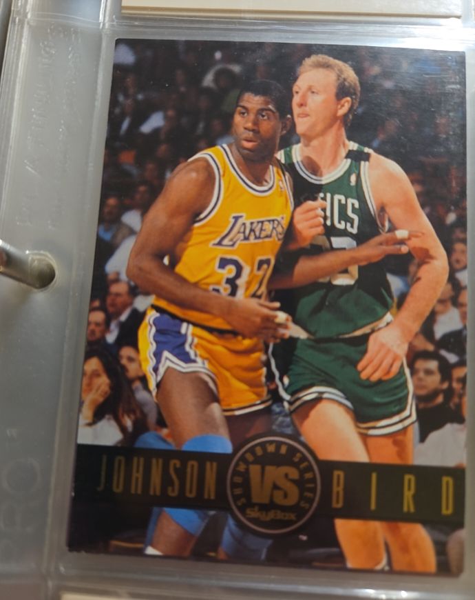 1993-94 SkyBox Premium Showdown Series #SS12 Magic Johnson vs Larry Bird — front