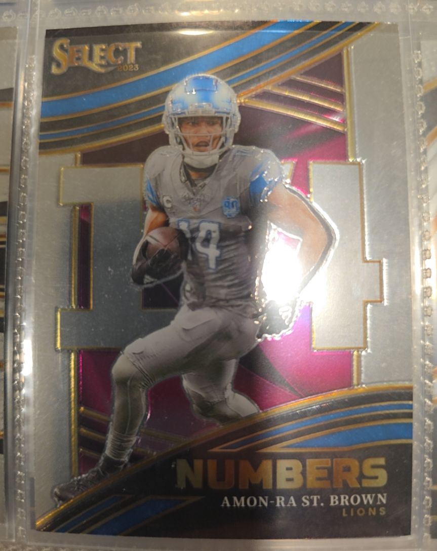2023 Panini Select #NMB-AST Amon-Ra St. Brown Select Numbers — front