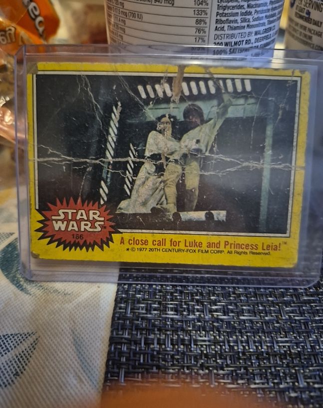 1977 Topps Star Wars Series 3 #166 A Close Call for Luke and Princess Leia — front