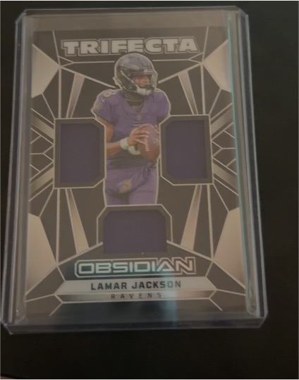 2024 Panini Obsidian Trifecta Swatches #TS-LJN Lamar Jackson — front