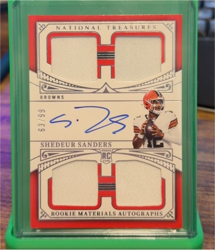 2025 Panini National Treasures #63 Shedeur Sanders Rookie Materials Autographs Quad Patch — front