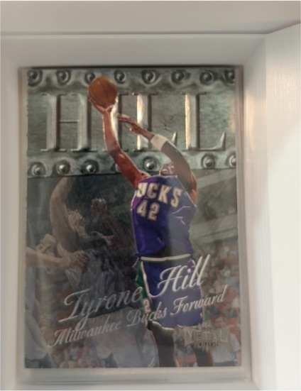 1998-99 Skybox Metal Universe #103 Tyrone Hill — front